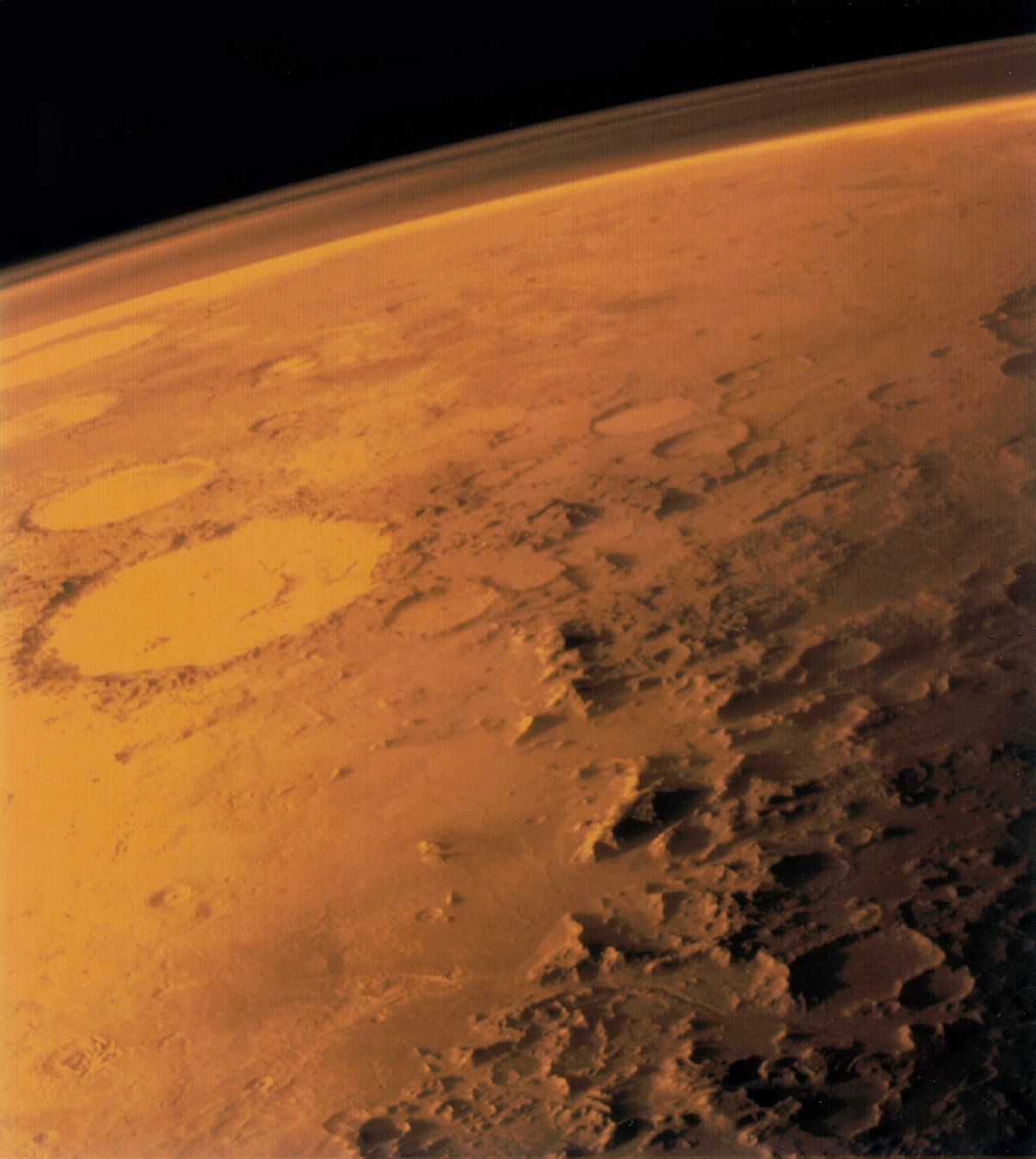 Credits: http://solarsystem.nasa.gov/multimedia/gallery/Mars__atmosphere.jpg This Viking 1 orbiter image shows the thin atmosphere of Mars. The mountains of the southern Argyre Basin is visible, with Galle crater left of center. Viking image number is 040A63. The photo was taken through red color filter.